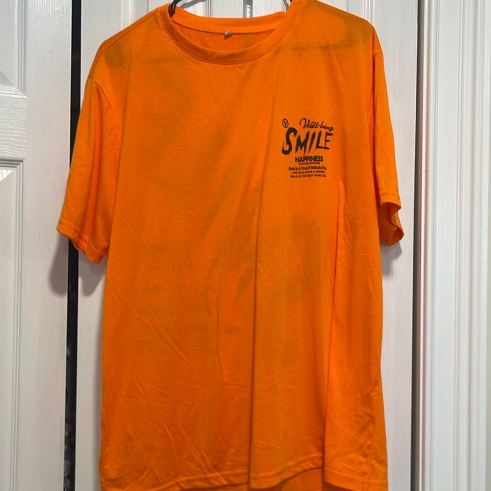 Orange T-shirt with positive vibe quote on front and back